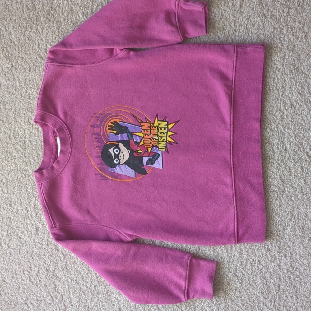 Disney The Incredibles Violet sweatshirt with a "Queen of the Unseen" graphic. 